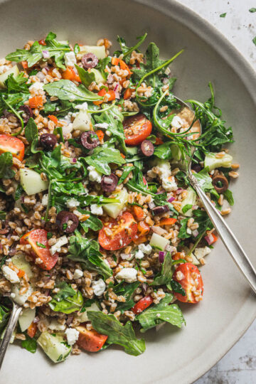 Mediterranean farro salad with arugula, feta, tomatoes, cucumber and Kalamata olives