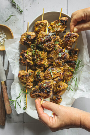 Serving grilled miso marinated steak tip skewers