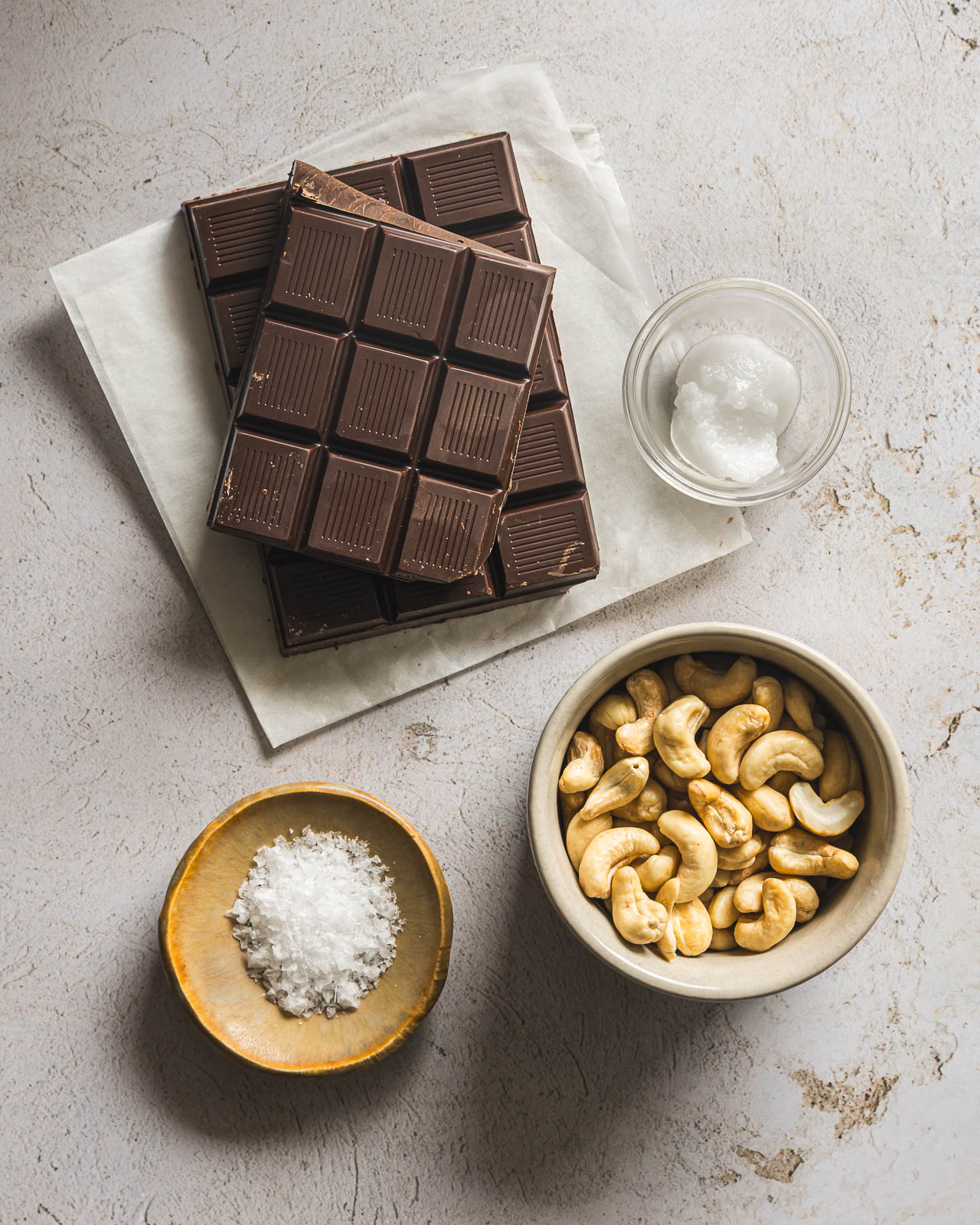 Dark chocolate, raw cashews, coconut oil and flaky sea salt for making cashew clusters