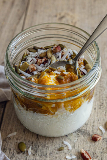 Pumpkin Greek Yogurt Bowl topped with pecans, pepitas and coconut
