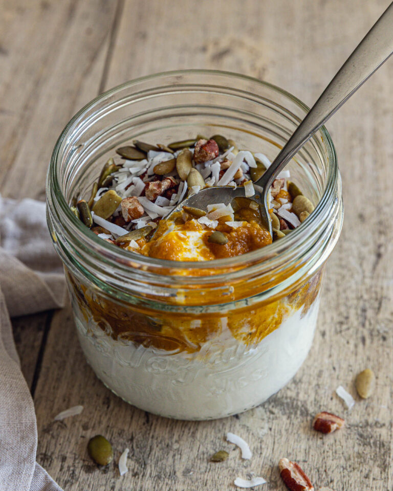 Pumpkin Greek Yogurt Bowl topped with pecans, pepitas and coconut