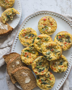 Veggie egg muffins with cottage cheese, broccoli, spinach and red pepper served with whole-grain toast