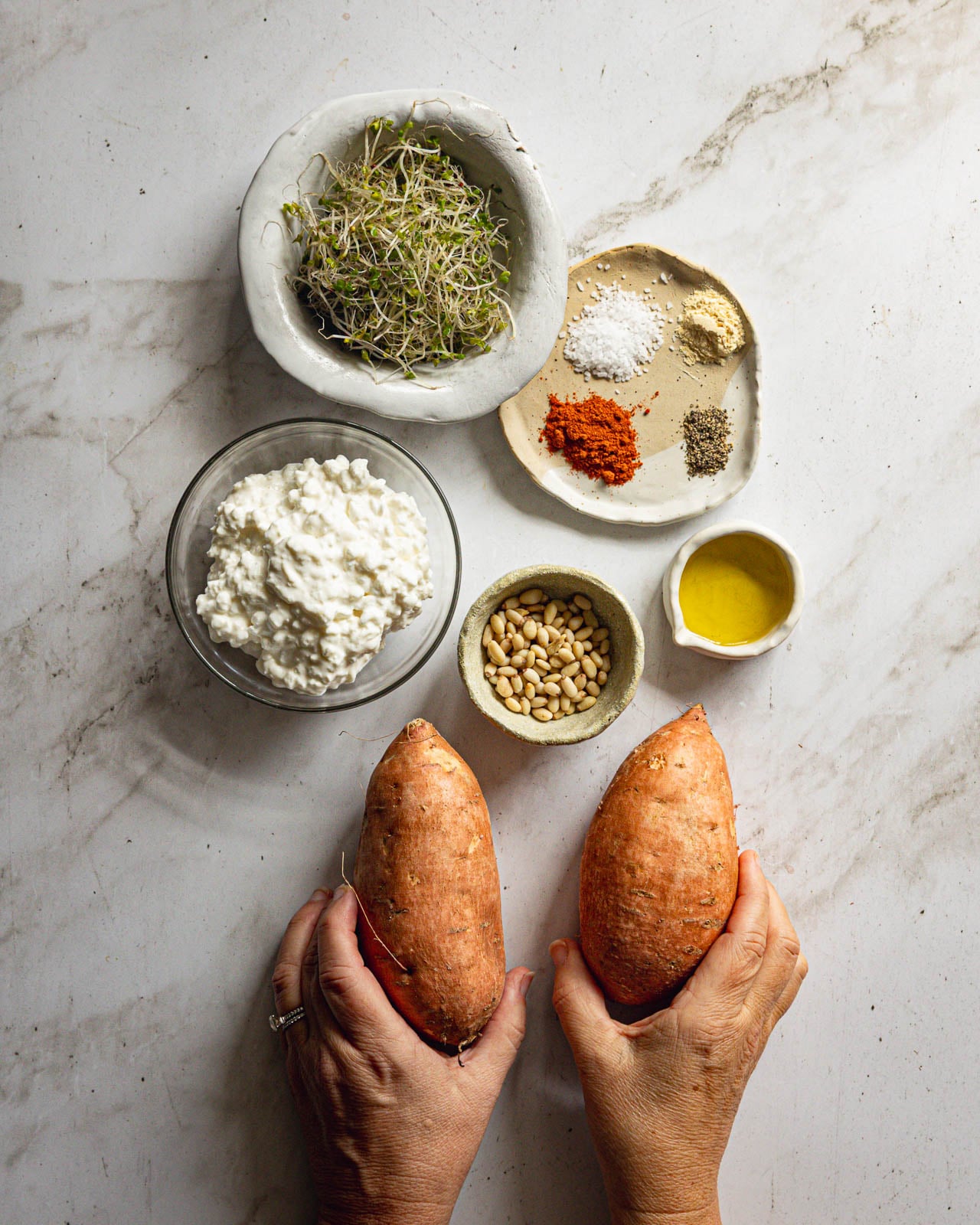 Sweet potatoes, cottage cheese, pine nuts, microgreens, olive oil and seasonings for caramelized sweet potatoes