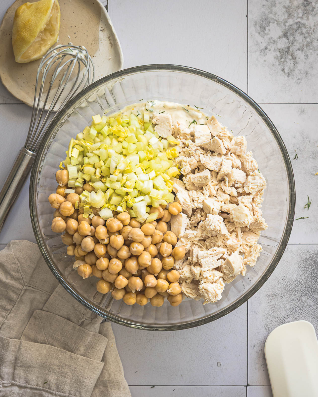 Diced chicken, chickpeas and celery added to creamy dressing