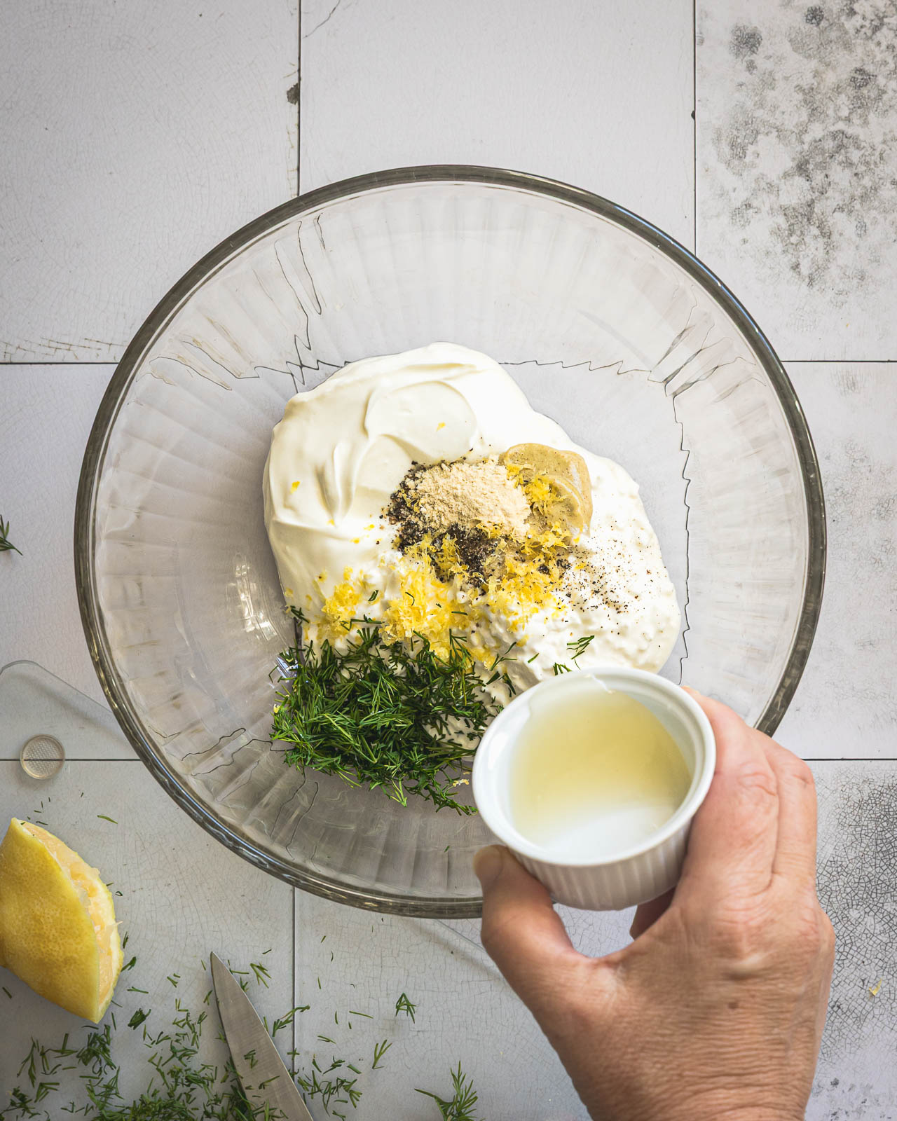 Adding fresh lemon juice to Greek yogurt and cottage cheese dressing